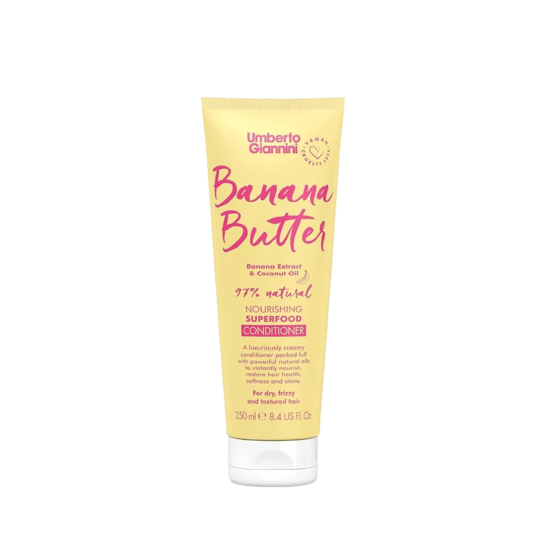 A 250ml squeeze tube of Umberto Giannini Banana Butter Conditioner, featuring a pale yellow body with pink and black text, set against a plain white background.